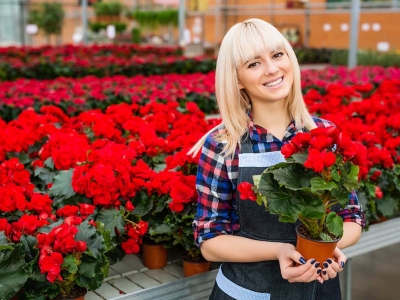 A florist holding red flowers